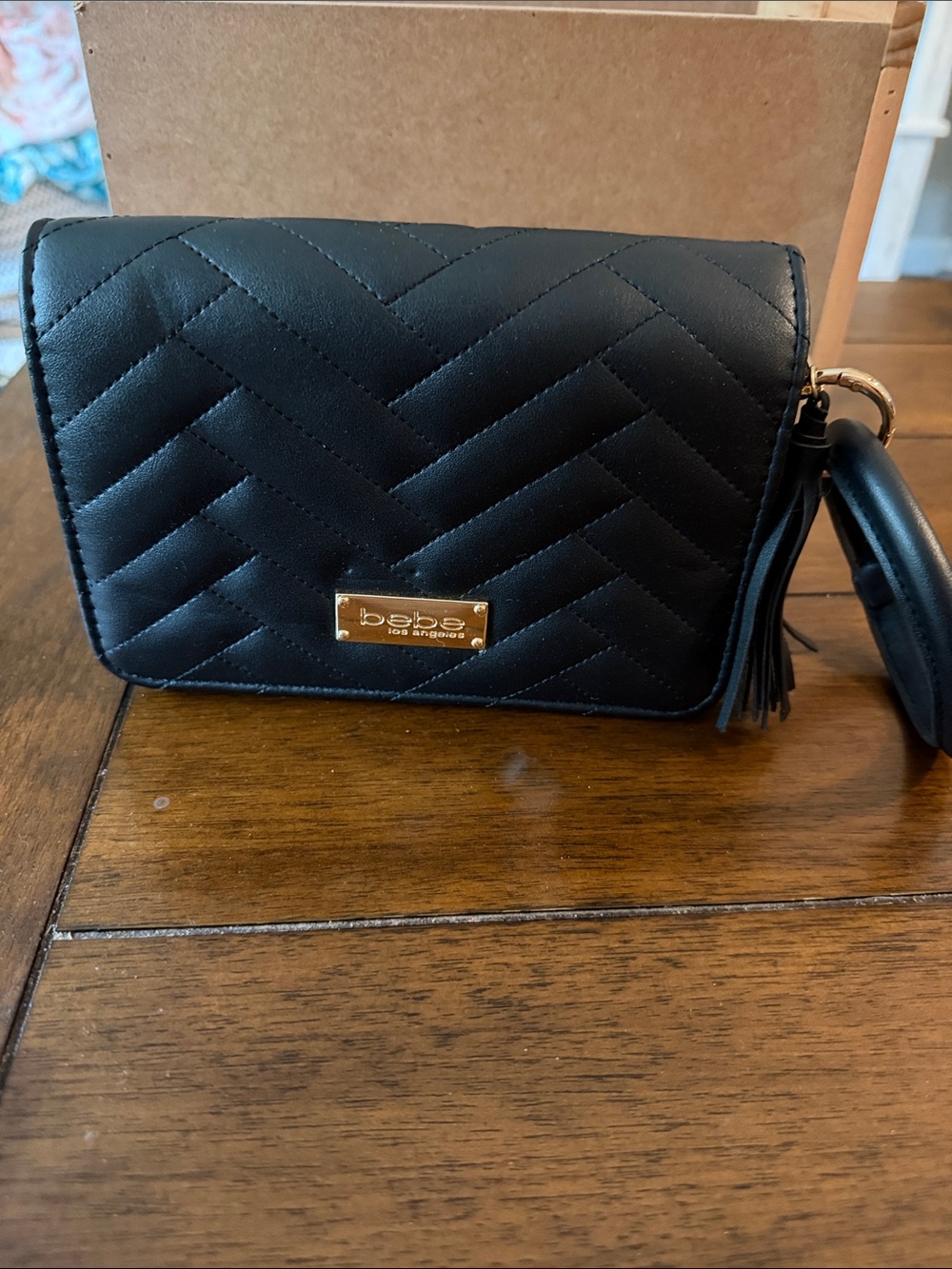 bebe Black Quilted Wristlet Clutch with Gold Plaque and Tassel